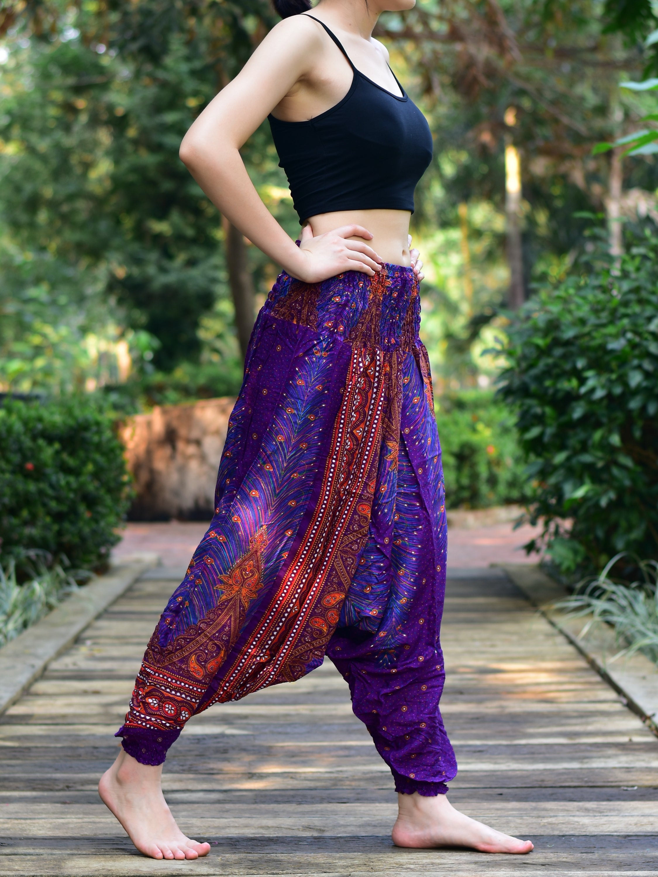 Bohotusk Purple Peacock Moonshine Low Crotch Harem Pants for women, showcasing vibrant colors and unique design, perfect for yoga and lounging.